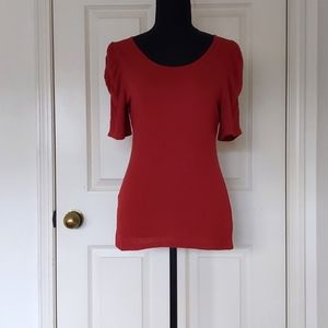 NWOT. The Limited 100% Rayon Burgundy Blouse with elastic on half sleeve.